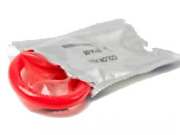 Condom partially in wrapper